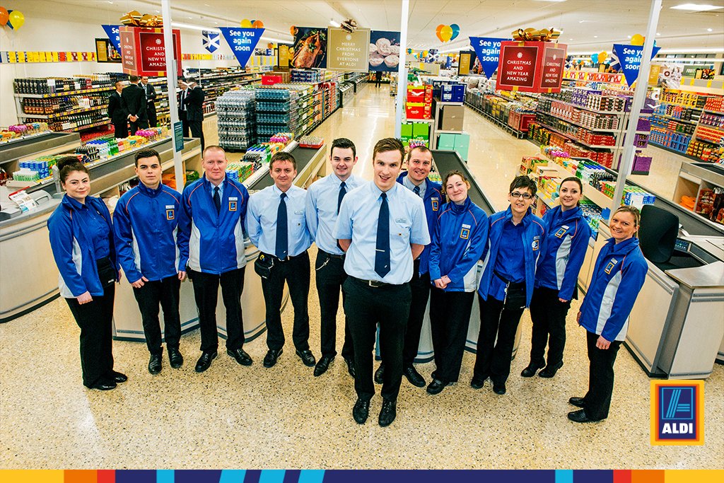 Aldi cashier assisting customers near you”
